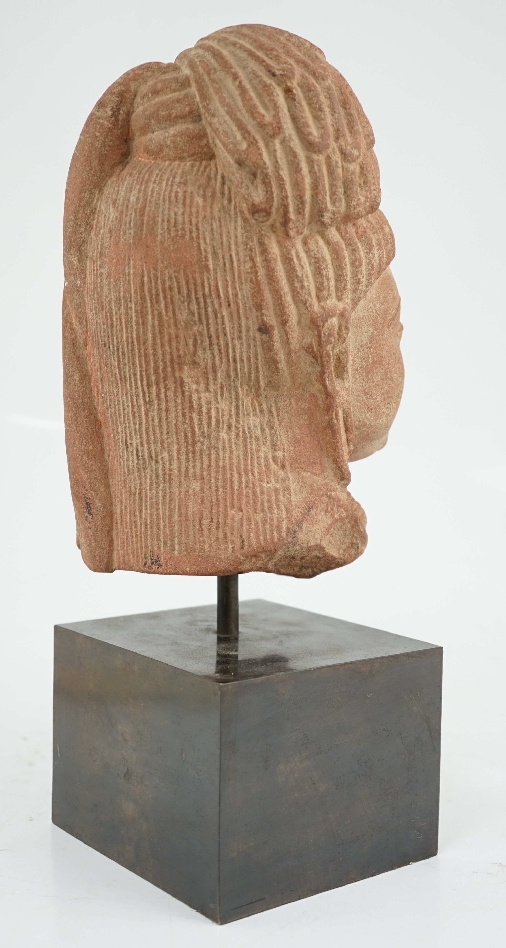 A red stone head of Ardhanarishvara, Muthura region, India, Gupta period, c.5th century A.D.
